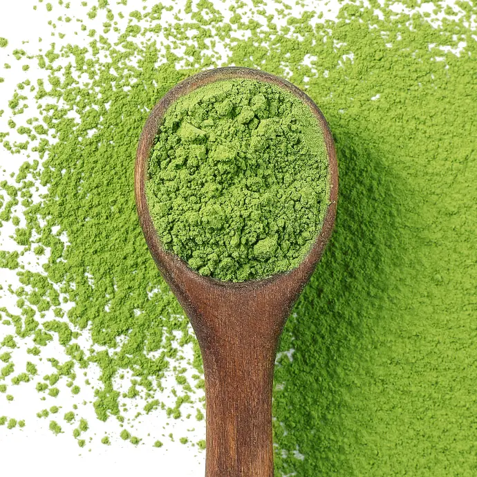 Matcha powder in a wooden spoon